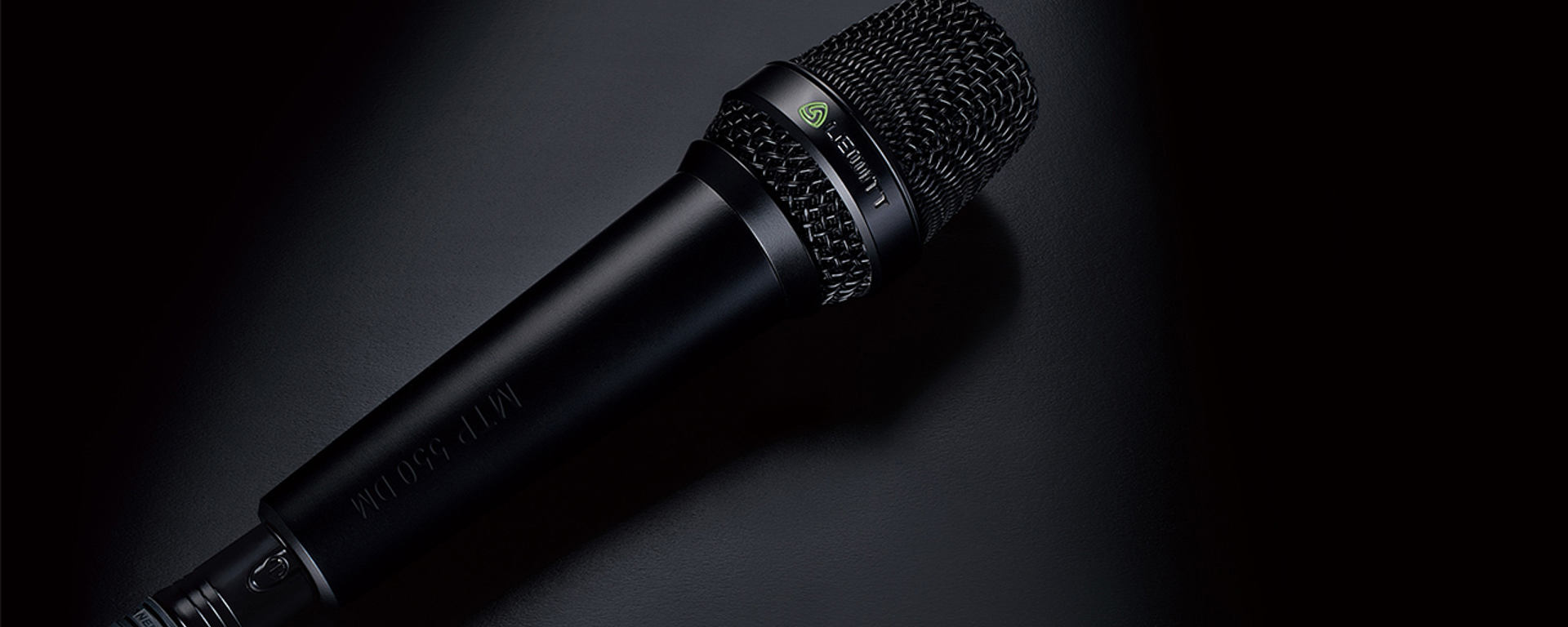 This image shows the MTP 550 DM live performance microphone on black background