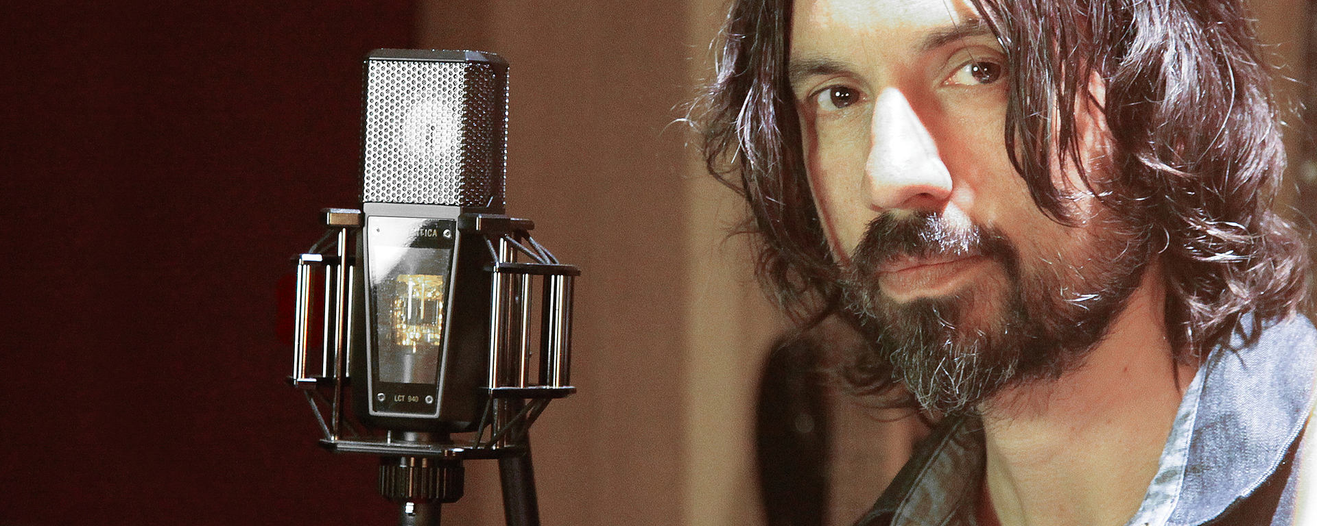 This image shows a sound engineer in studio with his LCT 940 Tube/FET microphone