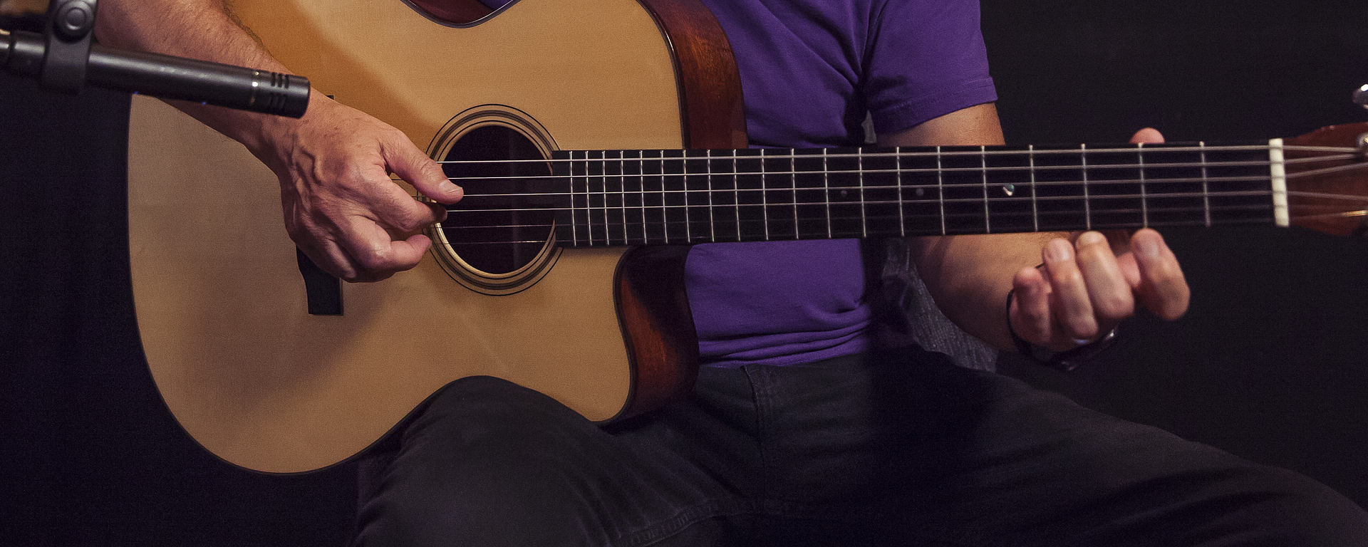 This image shows a LCT 140 small diaphragm condenser microphone on a Martin acoustic guitar